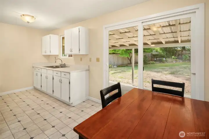 An efficient kitchen, right off the living room, has dining space and access to your private, peaceful backyard.