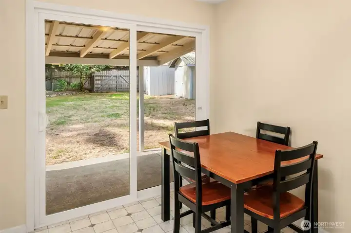 The cozy dining space is ready for your culinary delights.