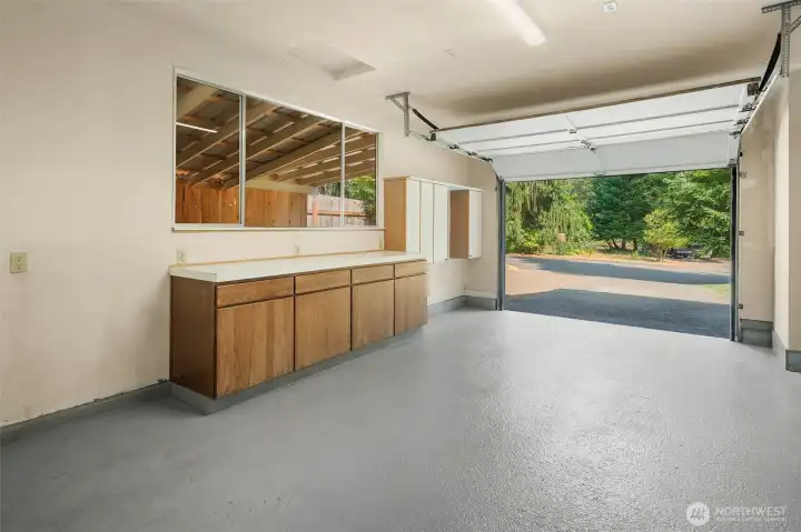 Extremely clean attached one-car garage has room for your workbench, tools, and groceries.