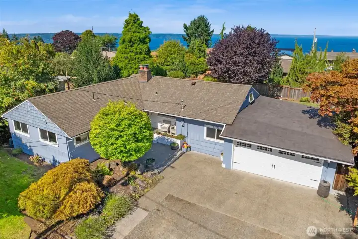 Beautiful Gregory Heights home with lush landscaping and great potential for Sound views