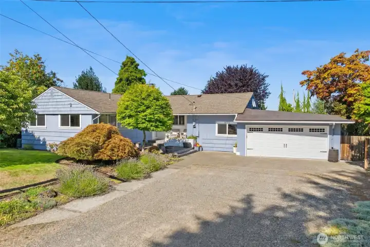 Spacious driveway, oversized 2-car garage, and inviting curb appeal