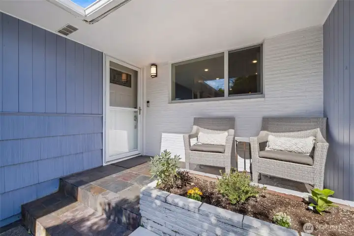 Charming entry with a cozy sitting area—perfect for morning coffee