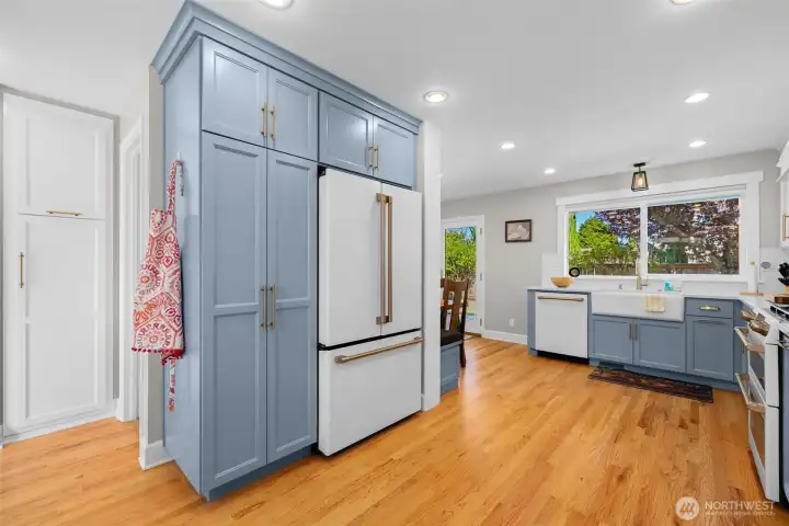 Built-in pantry wall with integrated refrigerator for a clean, stylish look