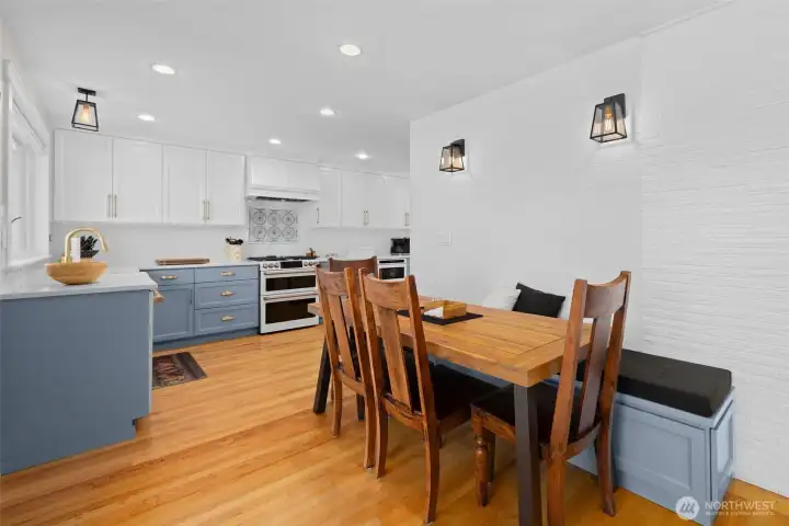 Cozy eating space with built-in bench seating and warm natural light
