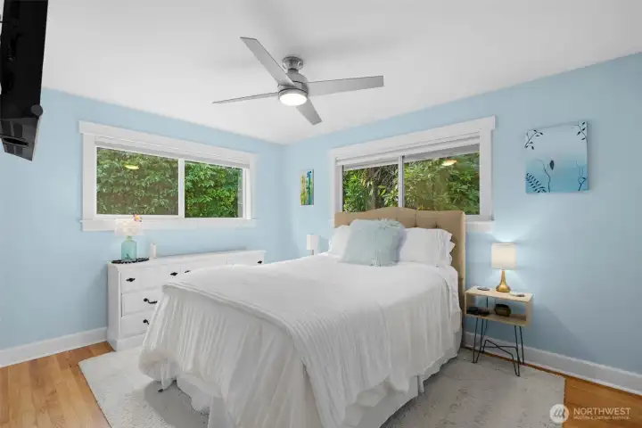 Peaceful retreat with dual windows and cooling ceiling fan