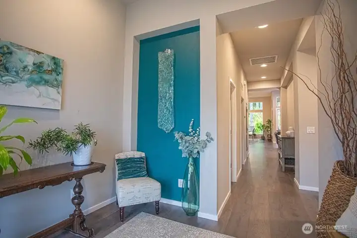 Feature wall at entry.  Wall mounted glass artwork does not convey.