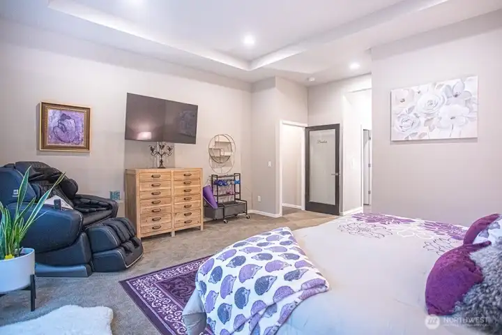 Primary bedroom looking back towards the door and the hall to the closet and bathroom
