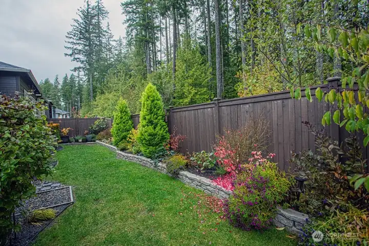 beautifully landscaped backyard.