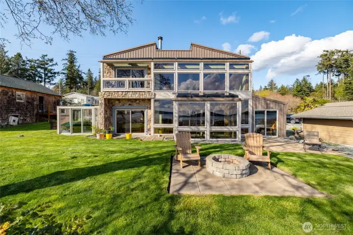 Live large in this 2600 +/- sf custom house on the water...