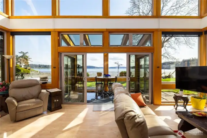 Living room slider opens to sun-room and the great outdoors... Windows equipped with great coverings...