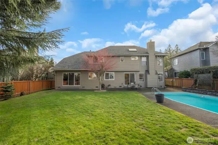 Spacious backyard retreat with pool, firepit, and room to relax or entertain