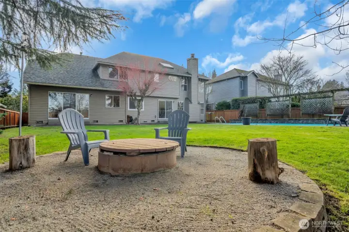Spacious backyard retreat with pool, firepit, and room to relax or entertain