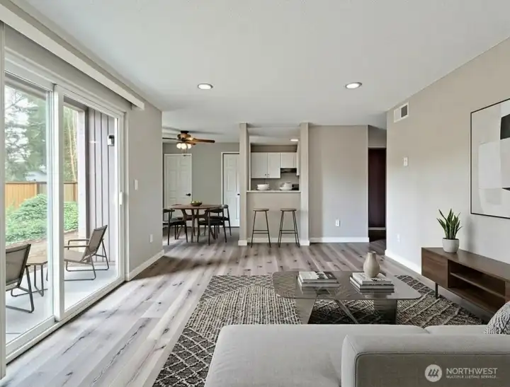 Living room to view of kitchen staged virtually