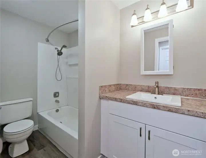 All new bathroom with brand new tub and designer tub  walls