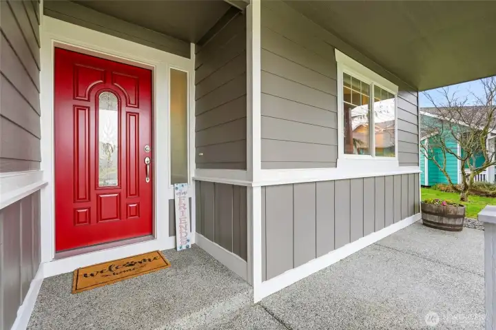A cheerful covered entry offers comfort in all seasons.
