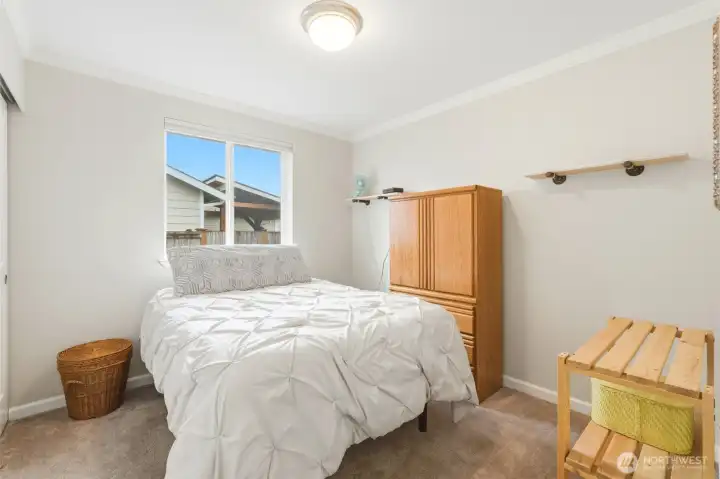 Comfortable and serene, this bedroom offers just the right amount of space.