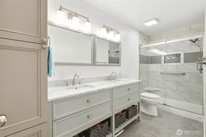 Beautifully updated with a double vanity and walk-in shower- bright, polished, and thoughtfully designed.