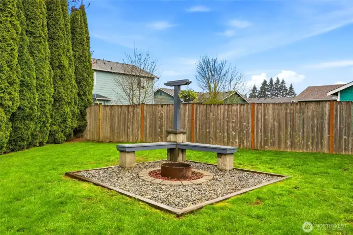 A perfect spot to gather- cozy up on the benches around the firepit and enjoy the moment.