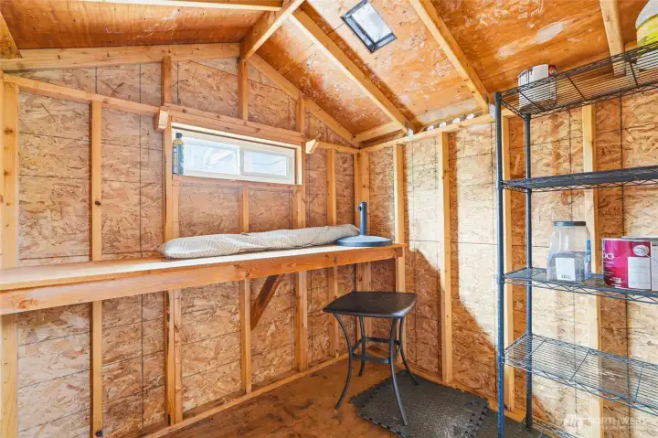 Handy shed provides for additional outdoor storage.