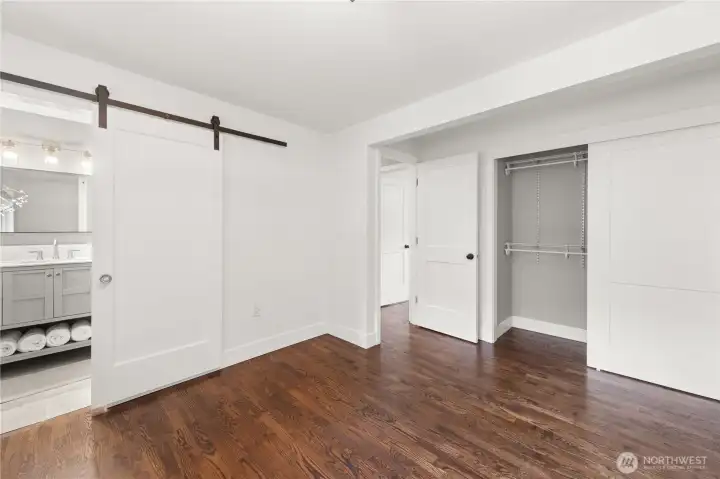 Primary Bedroom: Large closet with built in shelving.
