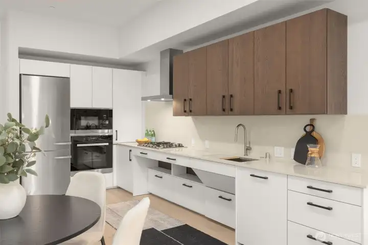 Miele appliances, quartz countertops, gas range and ADA Custom Cabinetry