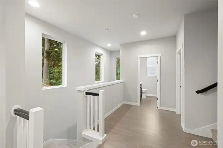 Second Floor/Main Floor Landing looking into main floor bedroom.