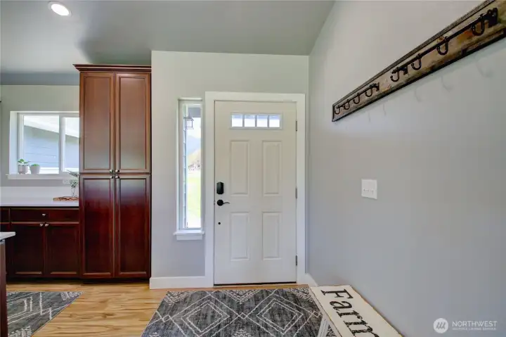Front entrance with vaulted ceiling.