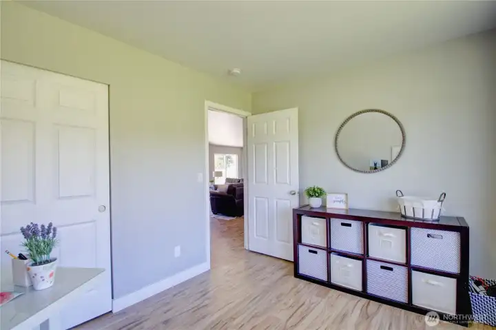 3rd bedroom with closet looking towards hall.