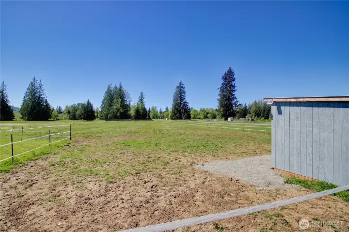 Newer horse/animal shelters in pasture.