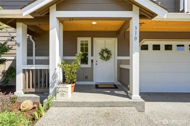 Covered entry porch allows for a space to kick your shoes off and come on in!