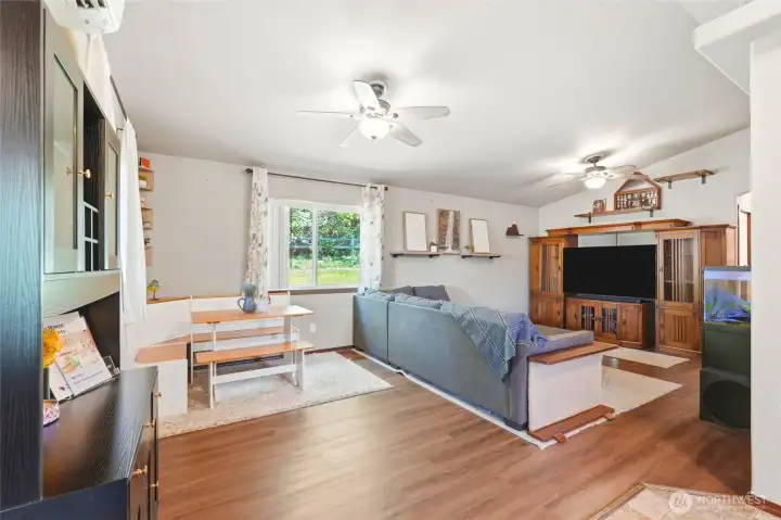 Vaulted ceiling. Open floor plan for living and dining space. Easy to maintain LVP flooring throughout.