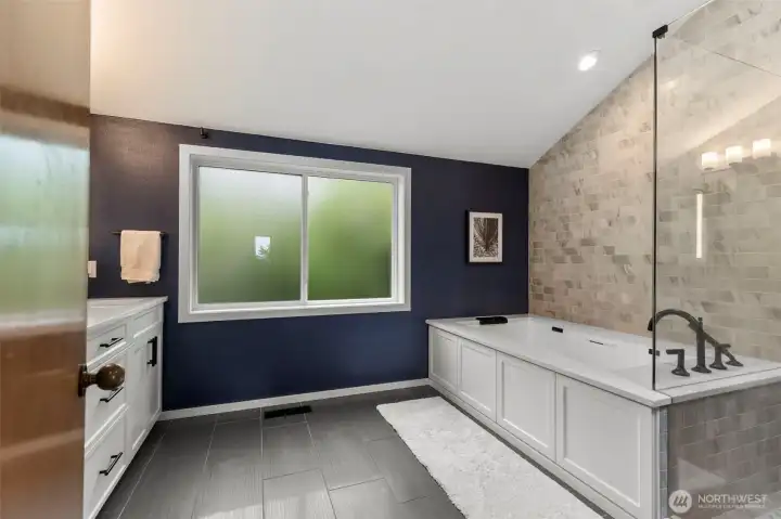 Ensuite with soaking tub, double shower and heated floors.