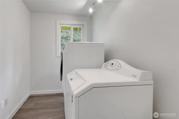 Laundry room, with Electrolux Washer and Maytage Dryer included.