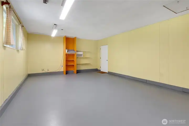 Family room or could be 3rd bedroom with new epoxy painted floors