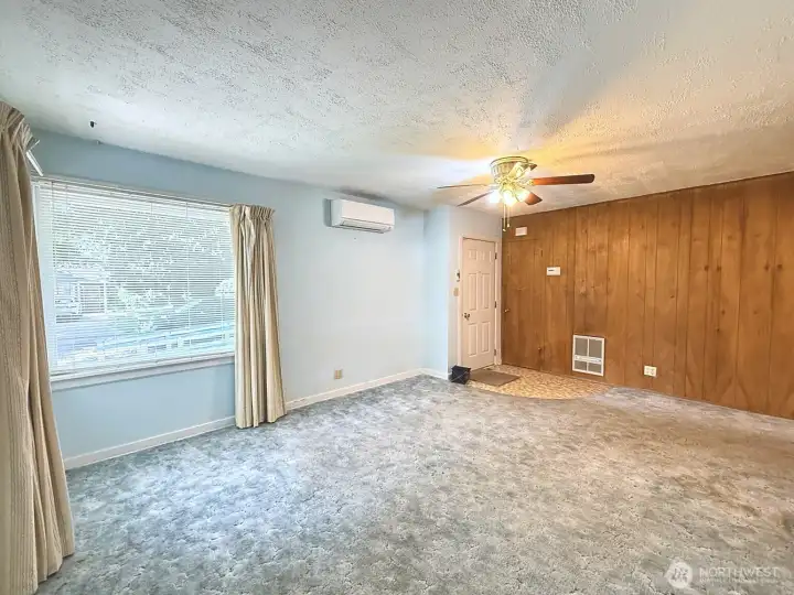 Living room is ready for your touches to make it a home, currently carpet but hardwoods underneath
