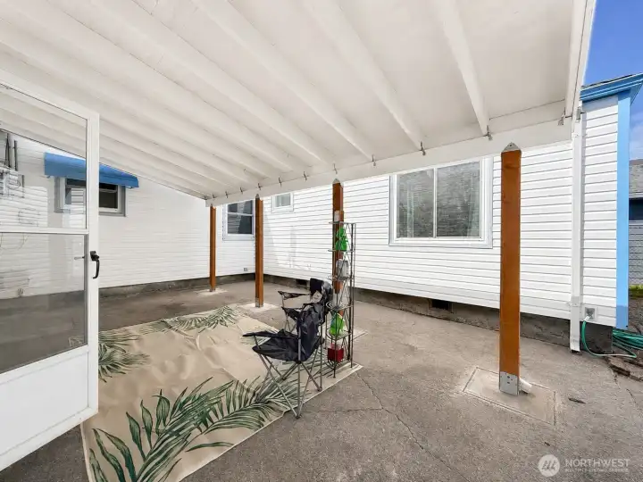 Covered patio in backyard that is secure and fully fenced