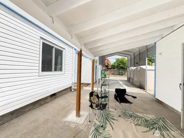 Covered patio  looking towards covered RV parking and storage sheds