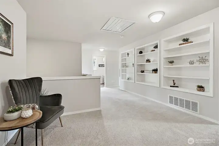 Large landing with built in shelves and room for a reading knook
