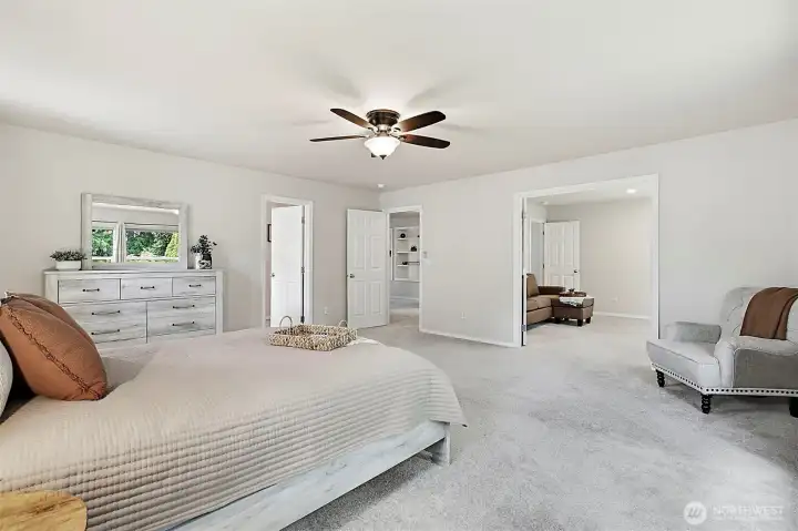 Primary suite featuring French doors that open into the fifth bedroom.