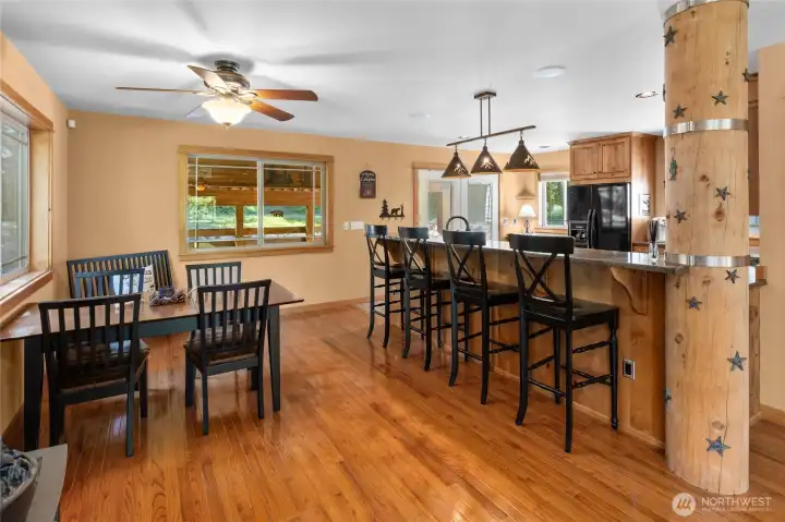 More Great Room featuring the dining space & raised eating bar area.