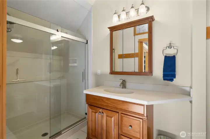 Primary Suite- includes a 3/4 bath, walk-in closet, & don't miss the custom glass etching above the door!