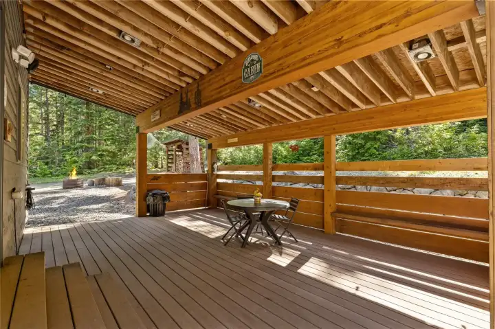 Covered back deck is amazing for all seasons. Being out here in the winter is like being in a snowglobe!