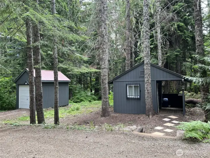 Don't miss the detached drive-thru snowmobile garage!  Holds up to 3 sleds or a large side by side. ALSO - adorable heated Bunkhouse for guests!