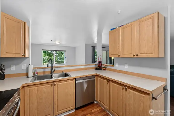 the kitchen is open to a dining room and the living room