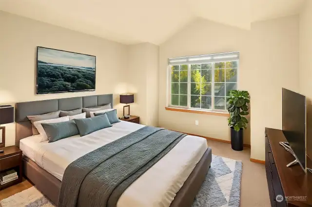 Bedroom 1, virtually staged.  Don't miss the large windows with views of the beautiful trees.