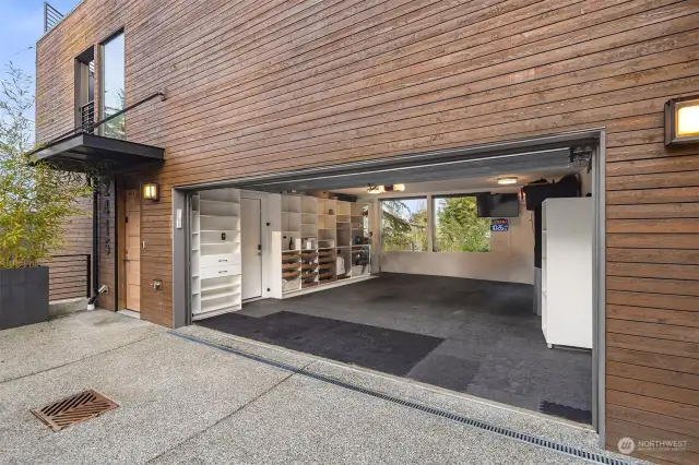 Oversized 2-car attached garage with an abundance of built-in storage. Owners used it as a workout space with treadmill, TV, & even added Heat/AC for year round use.