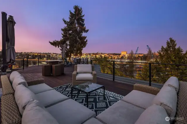 Spacious rooftop deck with variety of seating areas, all with stunning views.