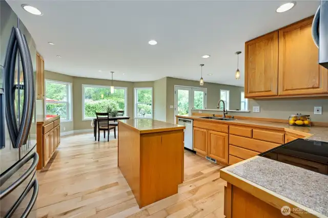 Kitchen has a nice view to the back yard and a wooded area beyond.