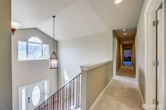The upstairs landing with views of the vaulted ceiling filled with lots of natural light.