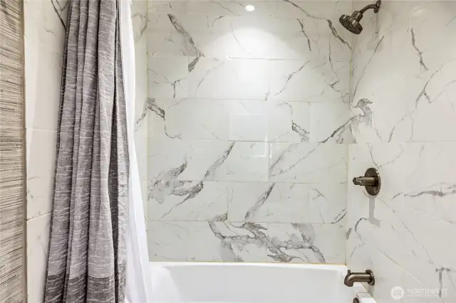 Upstairs tiled bath.